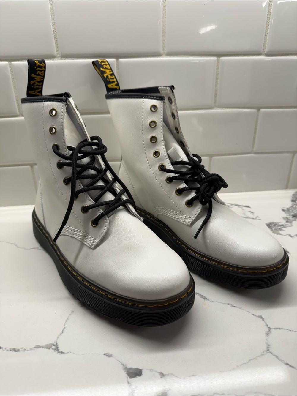 Dr. Martens White Leather Lace-Up Platform Boots with Black Sole